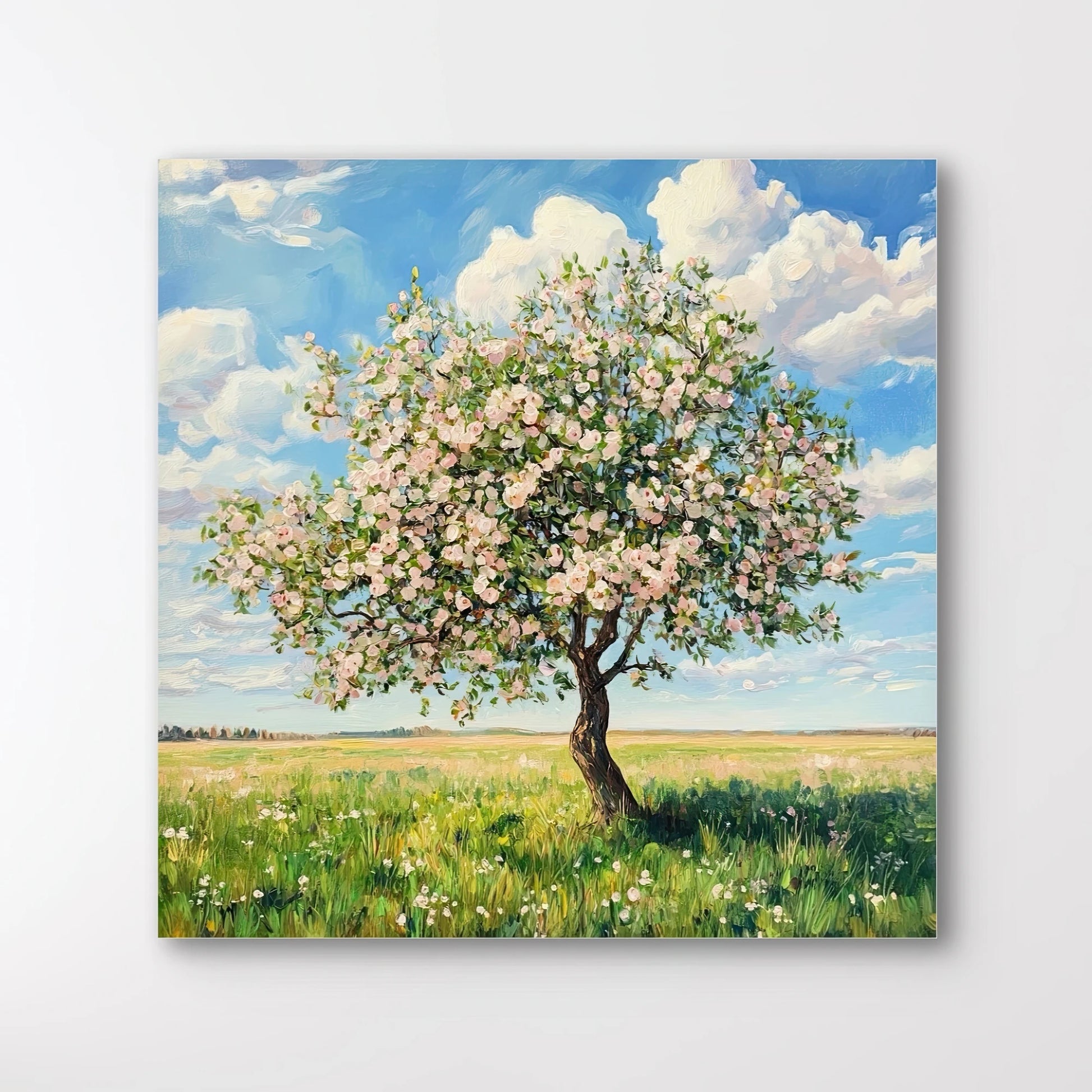 Detail van schilderachtig kunstwerk met bloesemboom in roze en wit op groene grasvlakte
