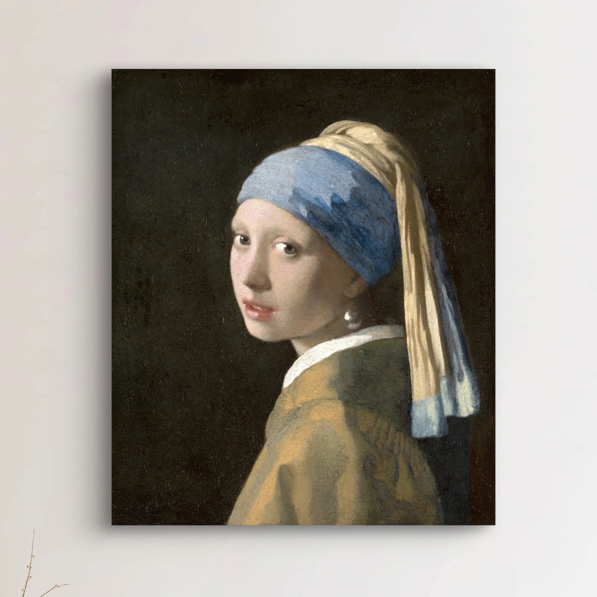 Volledige weergave van Meisje met de parel van Johannes Vermeer, met blauwe tulband en zachte uitdrukking
