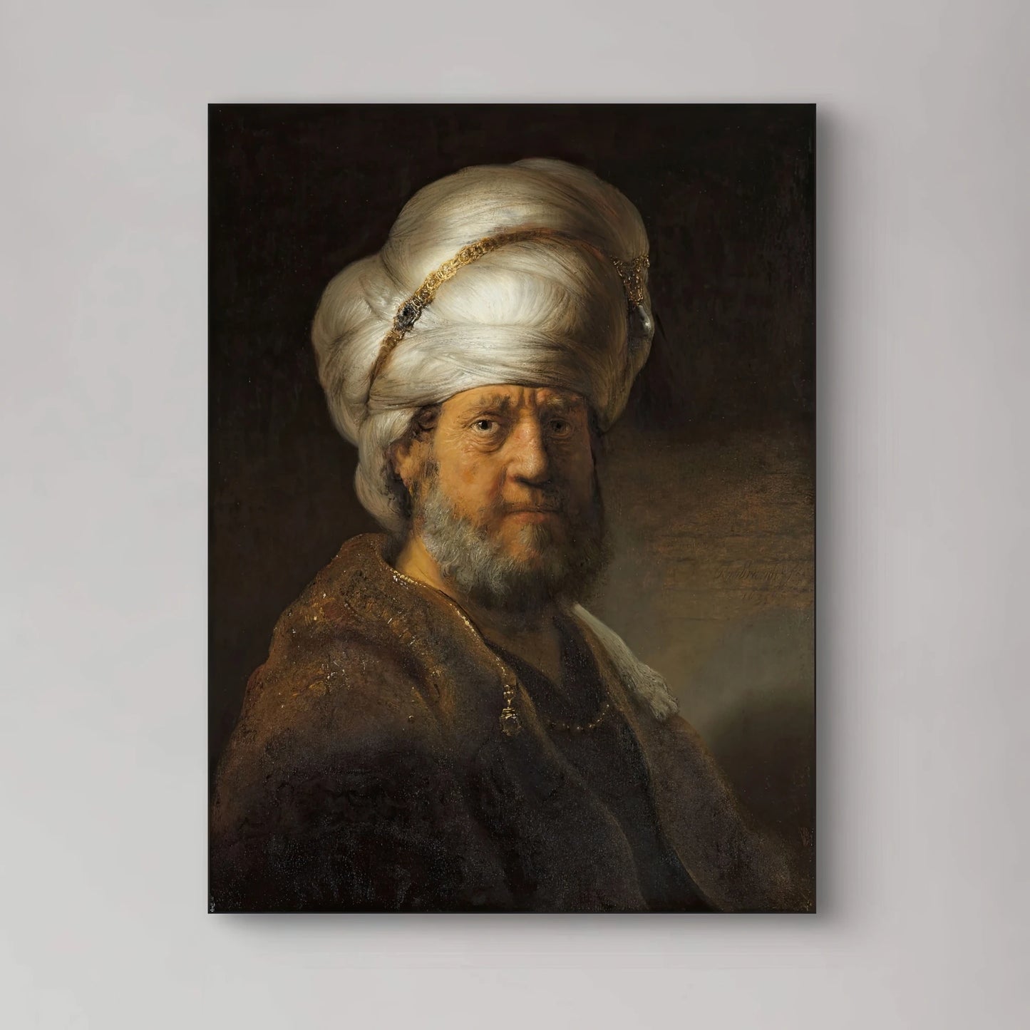 Detail van Rembrandts “Man in oosterse kleding” met tulband, baard en rijke stof in clair-obscur
